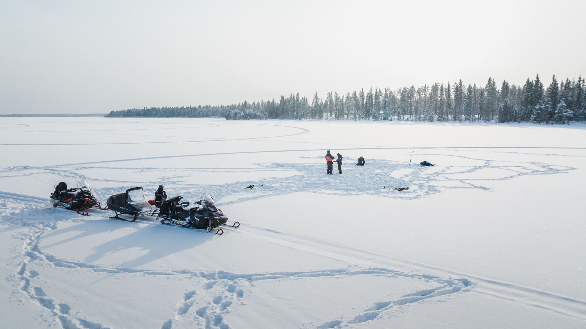 Ice Fishing and Snowmobile Safari Combo in Lapland
